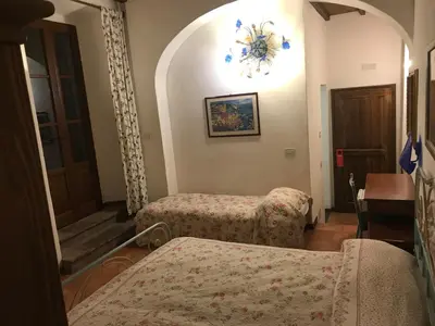 Letto o letti in una camera di B&B La Fonte del Machiavelli