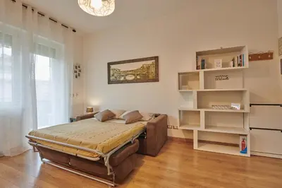 Letto o letti in una camera di Casa Gordigiani di Berti Anna - bilocali con parcheggio