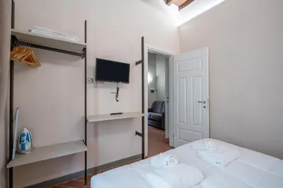Letto o letti in una camera di GuestHost - Ponte Vecchio Central Flats