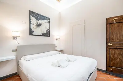 Letto o letti in una camera di GuestHost - Ponte Vecchio Central Flats