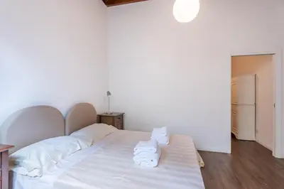 Letto o letti in una camera di Palazzo Vecchio Apartments by Mmega