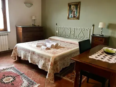 Letto o letti in una camera di Agriturismo Villani Poderi Nesti & Cupoli