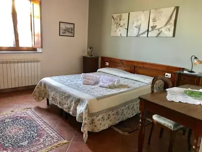 Letto o letti in una camera di Agriturismo Villani Poderi Nesti & Cupoli