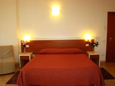 Letto o letti in una camera di B&B Soggiorno Ponte Rosso