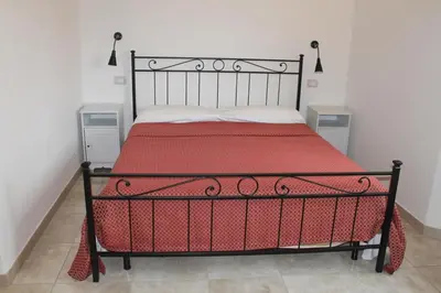 Letto o letti in una camera di B&B Soggiorno Ponte Rosso