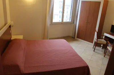Letto o letti in una camera di B&B Soggiorno Ponte Rosso