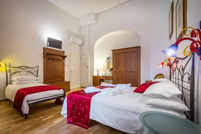 Letto o letti in una camera di HomEdo B&B