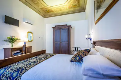 Letto o letti in una camera di HomEdo B&B