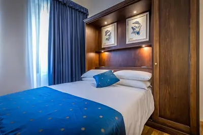 Letto o letti in una camera di HomEdo B&B