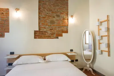 Letto o letti in una camera di Ognissanti apartment