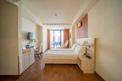 Letto o letti in una camera di Hotel della Signoria