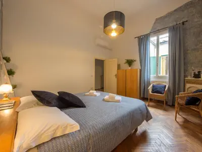 Letto o letti in una camera di San Lorenzo Family Apartment