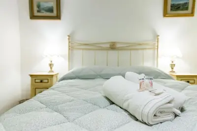 Letto o letti in una camera di Casa Savonarola Charme