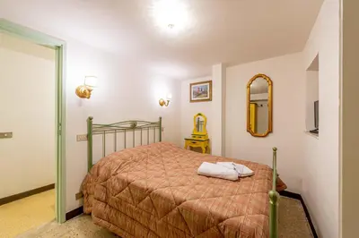 Letto o letti in una camera di Casa Savonarola Charme