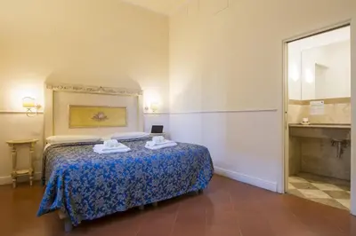 Letto o letti in una camera di Relais Tiffany