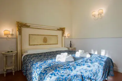 Letto o letti in una camera di Relais Tiffany