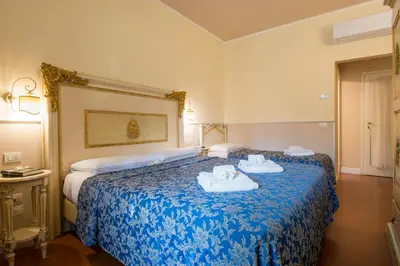 Letto o letti in una camera di Relais Tiffany