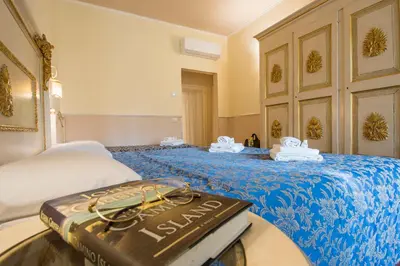 Letto o letti in una camera di Relais Tiffany