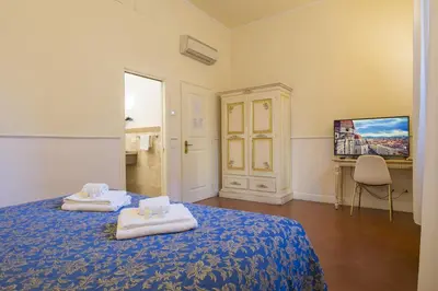 Letto o letti in una camera di Relais Tiffany