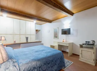 Letto o letti in una camera di Numa Florence Palazzo Haggis