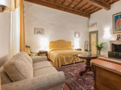 Letto o letti in una camera di Numa Florence Palazzo Haggis