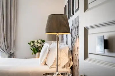 Letto o letti in una camera di Corte Calzaiuoli Elegant Suites