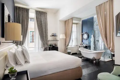 Letto o letti in una camera di Corte Calzaiuoli Elegant Suites