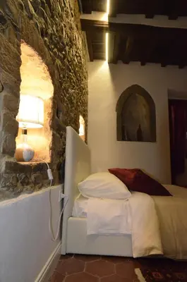 Letto o letti in una camera di Suite la Nicchia Guelfa