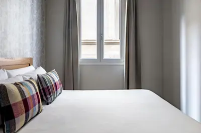 Letto o letti in una camera di Numa Florence Fiore
