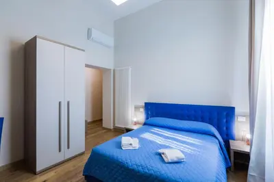 Letto o letti in una camera di VRooms All'Angolo Del Duomo