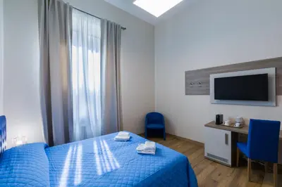 Letto o letti in una camera di VRooms All'Angolo Del Duomo