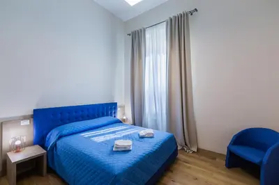 Letto o letti in una camera di VRooms All'Angolo Del Duomo