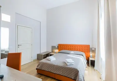 Letto o letti in una camera di VRooms All'Angolo Del Duomo