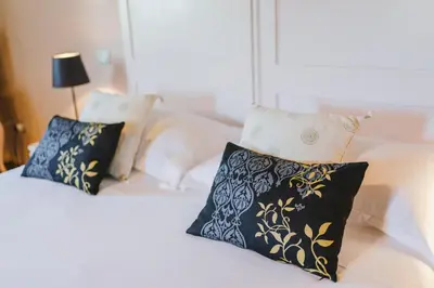 Letto o letti in una camera di Duchess Boutique de Charme