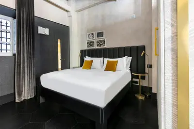 Letto o letti in una camera di Numa Florence Palazzo Moro