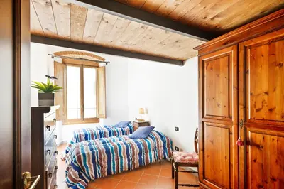 Letto o letti in una camera di GuestHost - San Lorenzo Wooden Loft