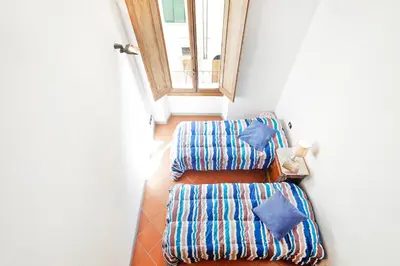Letto o letti in una camera di GuestHost - San Lorenzo Wooden Loft