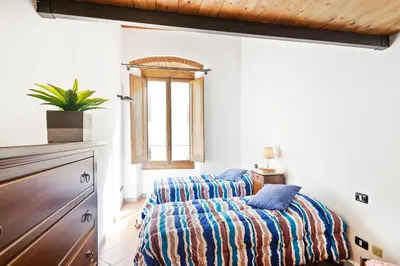 Letto o letti in una camera di GuestHost - San Lorenzo Wooden Loft