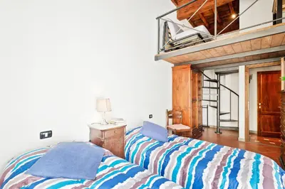 Letto o letti in una camera di GuestHost - San Lorenzo Wooden Loft