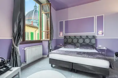 Letto o letti in una camera di B&B Le Stanze del Duomo