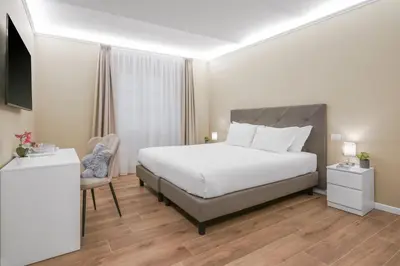 Letto o letti in una camera di B&B Le Stanze del Duomo