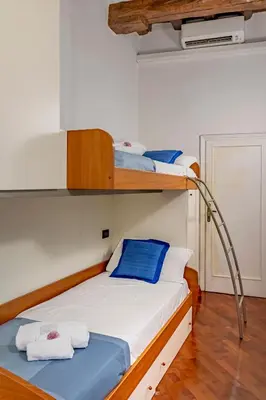 Letto o letti in una camera di Dante's Rooms