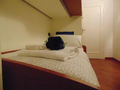 Letto o letti in una camera di Dante's Rooms