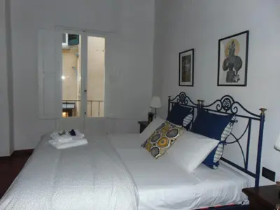 Letto o letti in una camera di Dante's Rooms