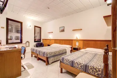 Letto o letti in una camera di Hotel Lorena
