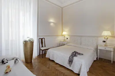 Letto o letti in una camera di Palazzo Lombardo