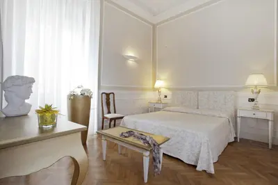 Letto o letti in una camera di Palazzo Lombardo