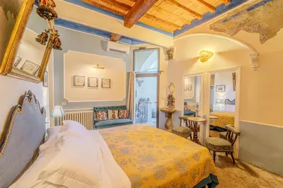 Letto o letti in una camera di Relais & Maison Grand Tour