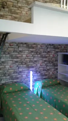 Letto o letti in una camera di Terrazza Giraldi