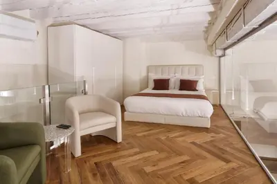 Letto o letti in una camera di Loft moderno vista centro città J House